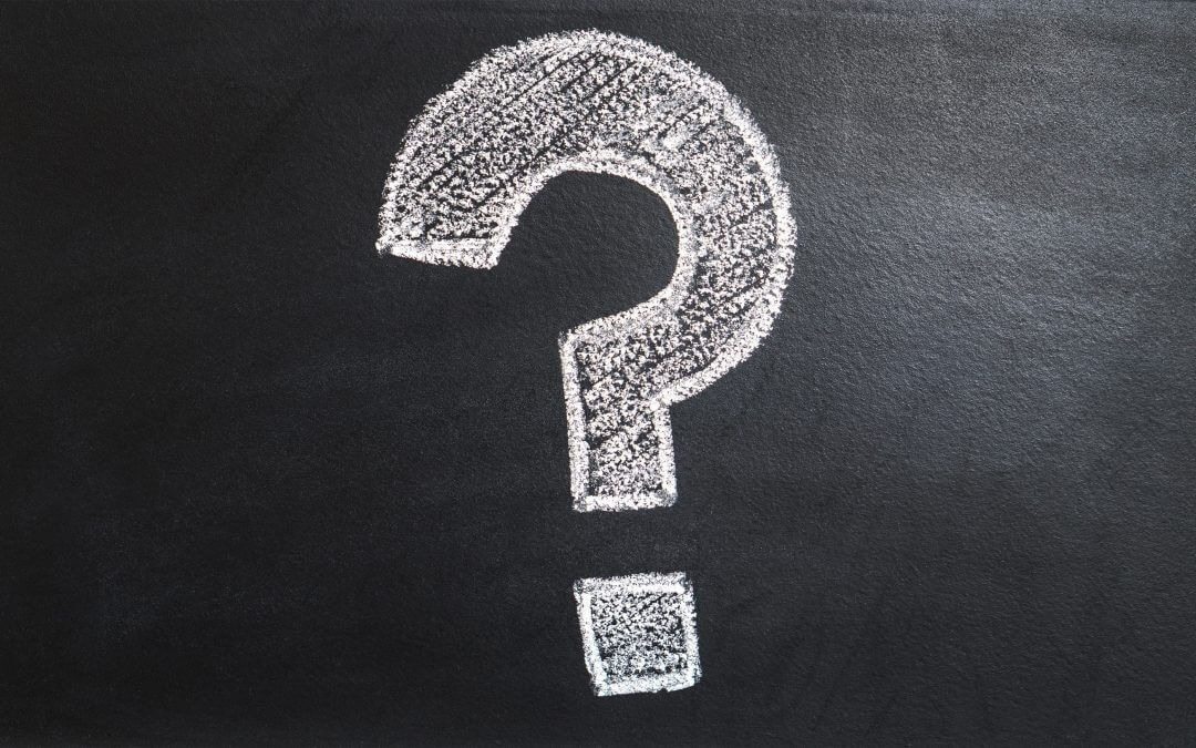 A big question mark is drawn on a chalkboard questioning the use of email marketing